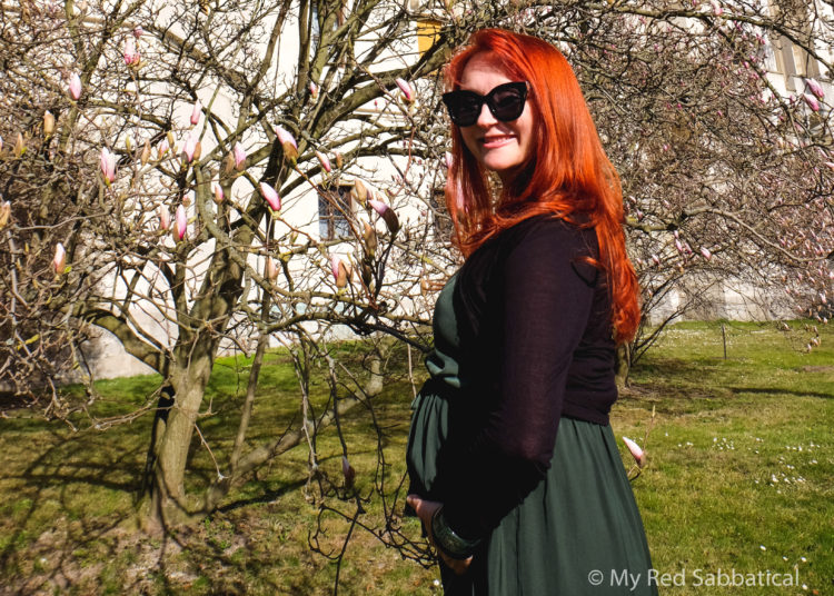 pregnant travel third trimester Marcela from My Red Sabbatical in Hluboka Nad Vltavou Czech Republic in spring with magnolia